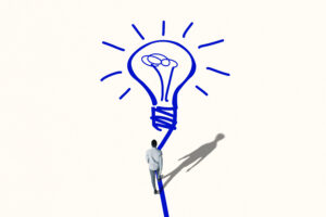 Eine Person geht auf einer gezeichneten Linie in Form einer großen blauen Glühbirne, die als Symbol für eine Idee steht.