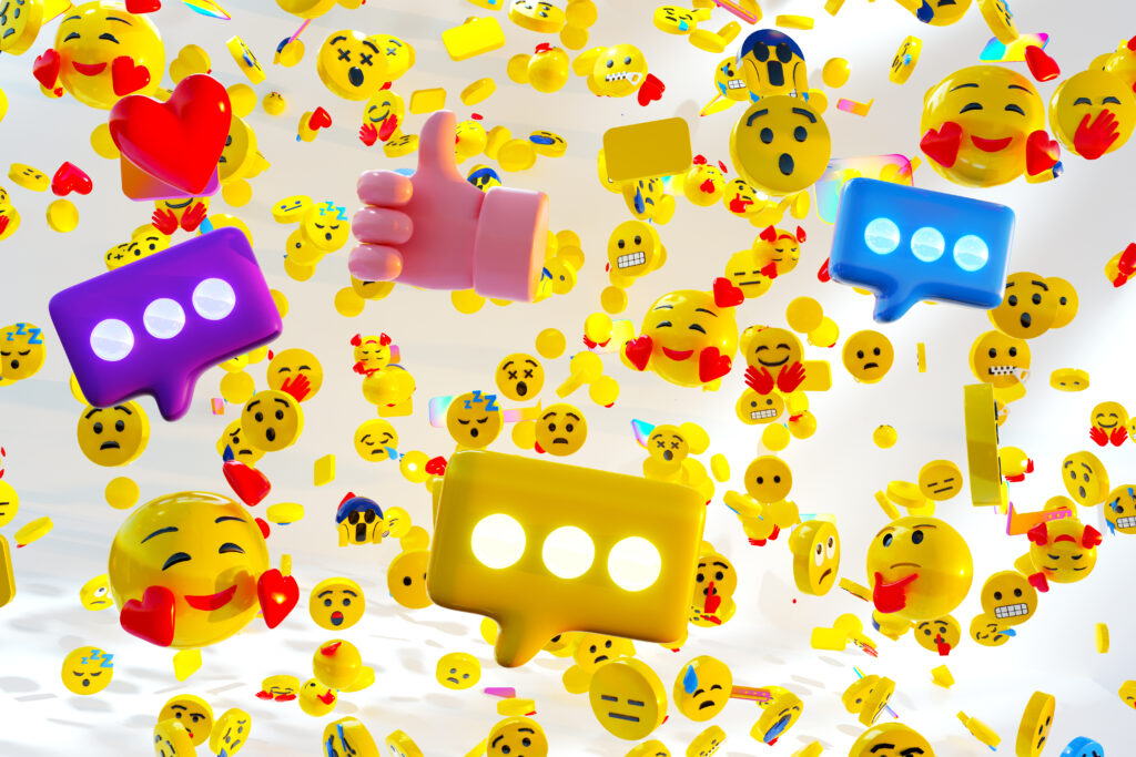 Viele gelbe 3D-Emojis, Herzen, Sprechblasen und ein Daumen-hoch-Symbol schweben vor einem hellen Hintergrund.